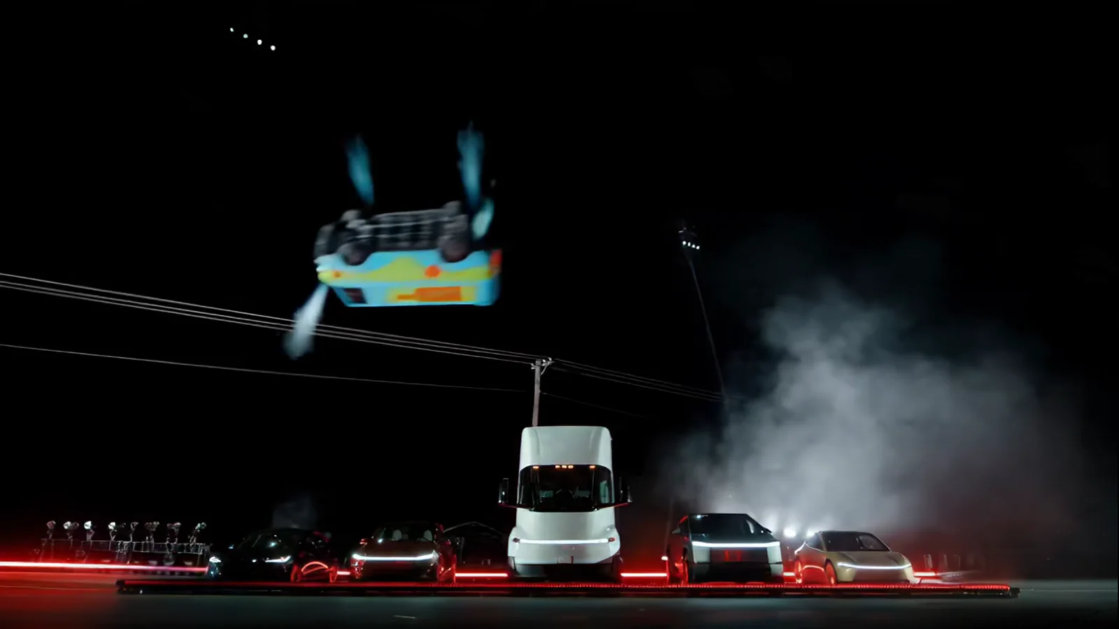 The same frame with the Mystery Machine van upside down in mid-air in place of the Roadster.